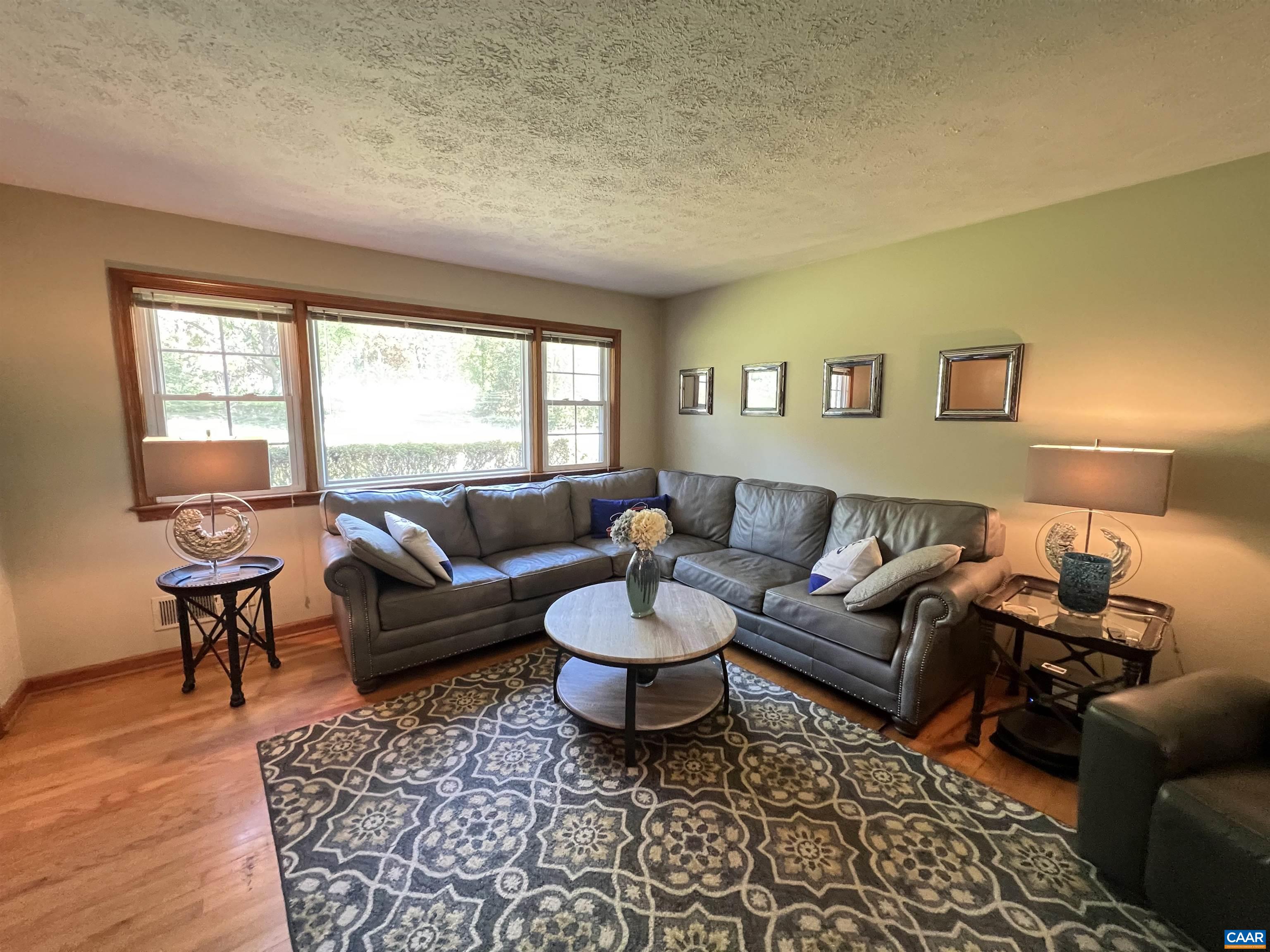 3515 Richmond Road Keswick, VA 22947 - Photo 11 of 47 a living room with furniture and a large window