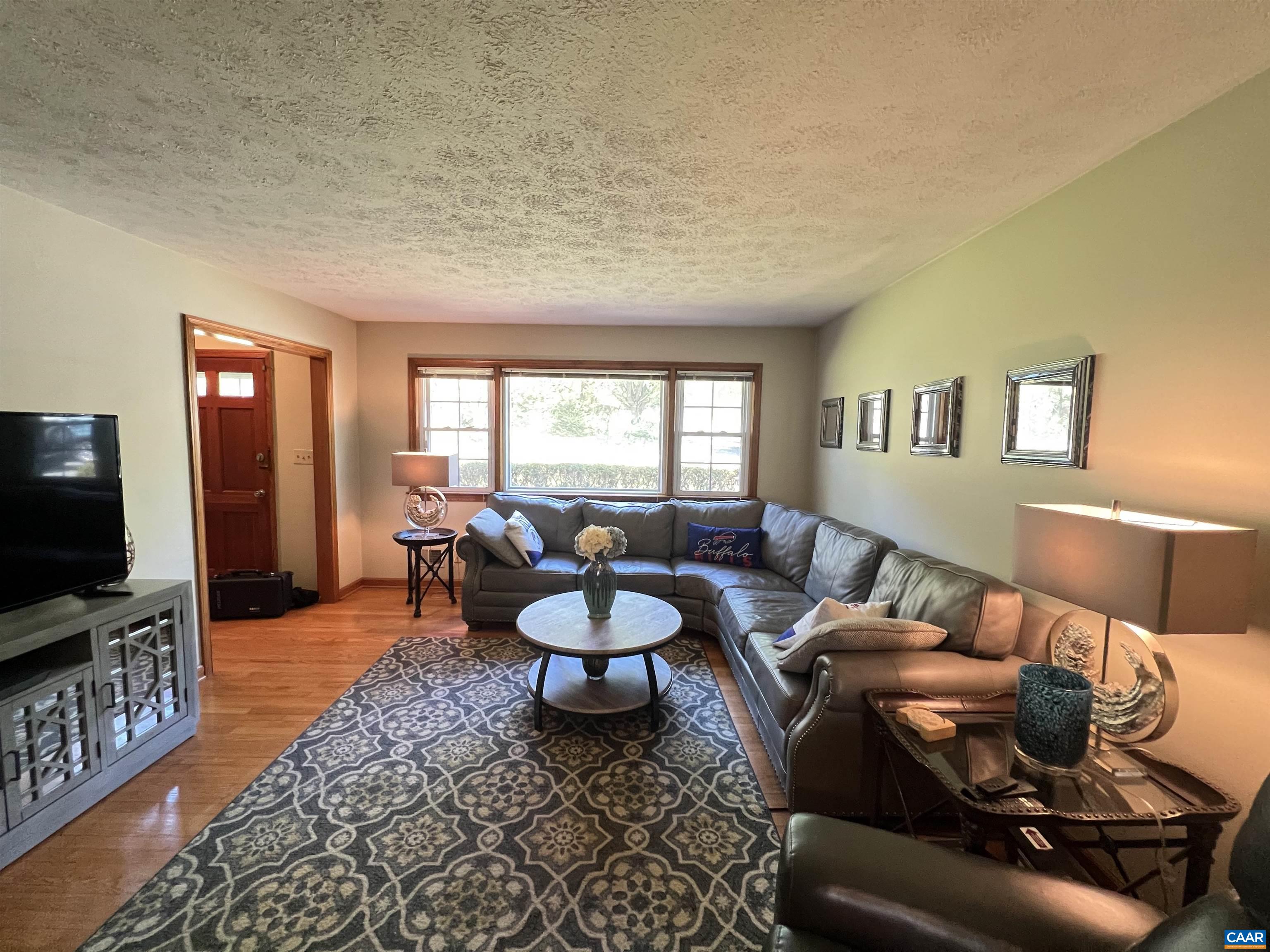 3515 Richmond Road Keswick, VA 22947 - Photo 12 of 47 a living room with furniture and a flat screen tv