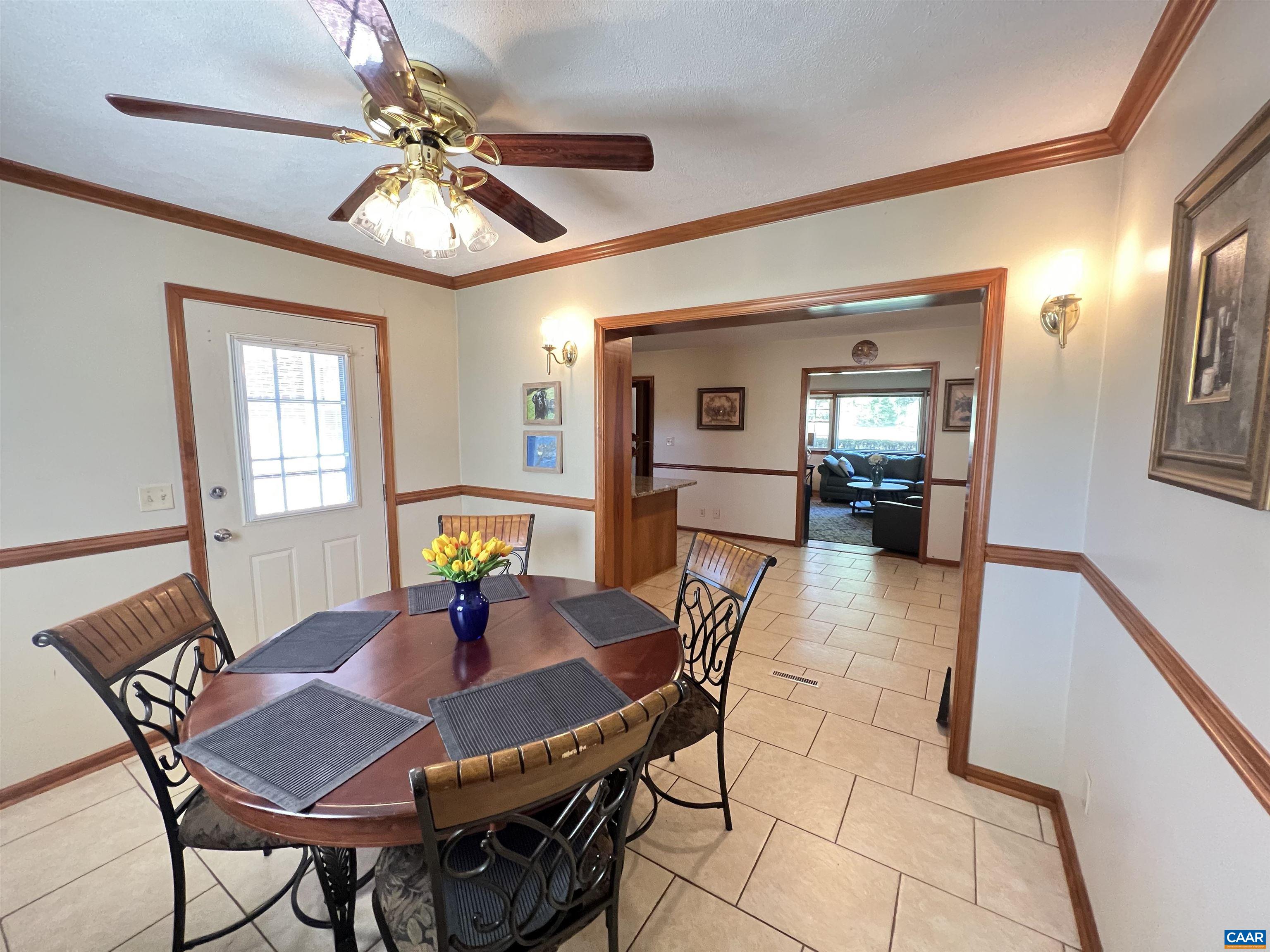 3515 Richmond Road Keswick, VA 22947 - Photo 15 of 47 a view of a dining room with furniture and chandelier