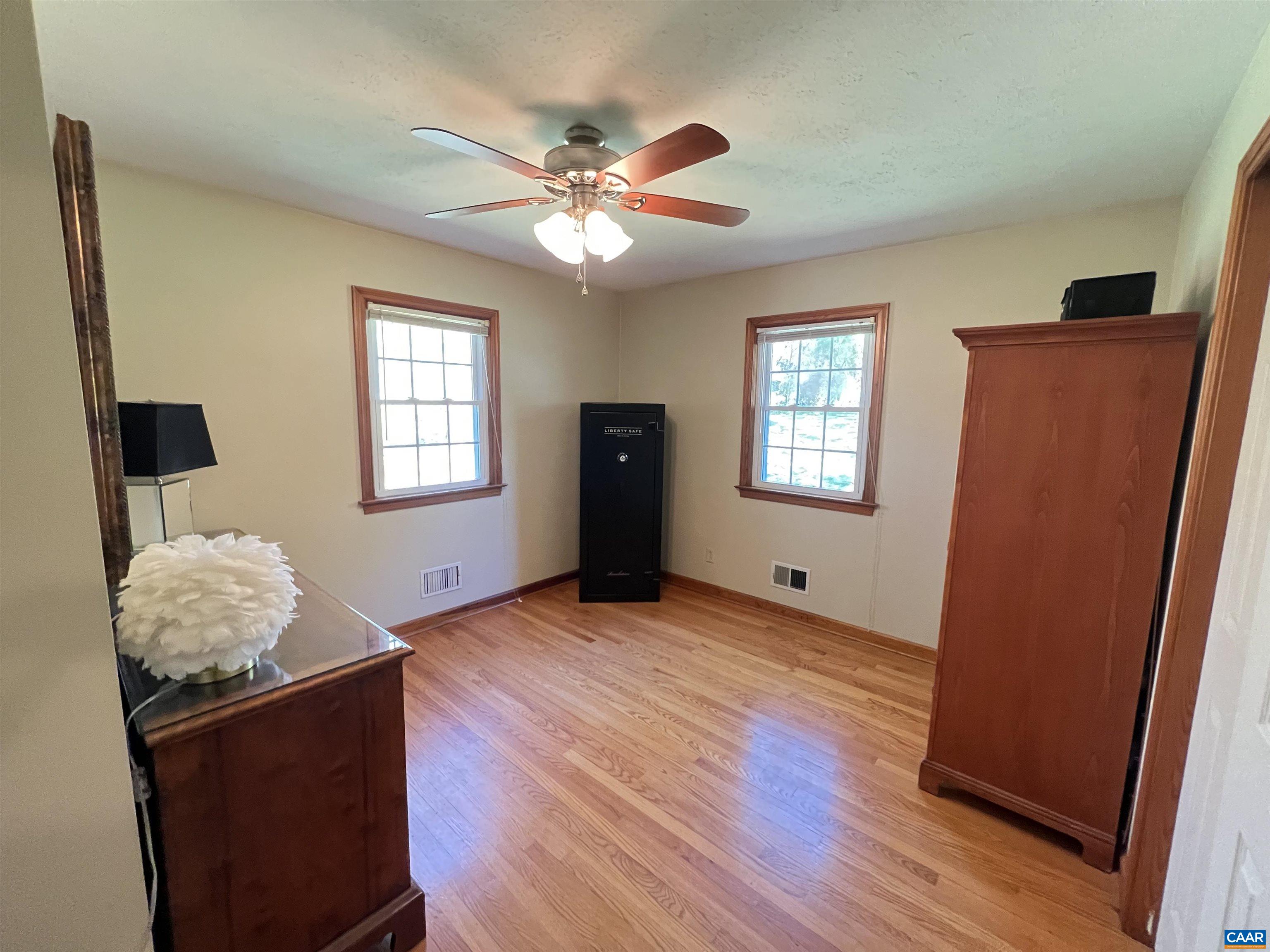 3515 Richmond Road Keswick, VA 22947 - Photo 20 of 47 a view of an empty room with wooden floor and a window