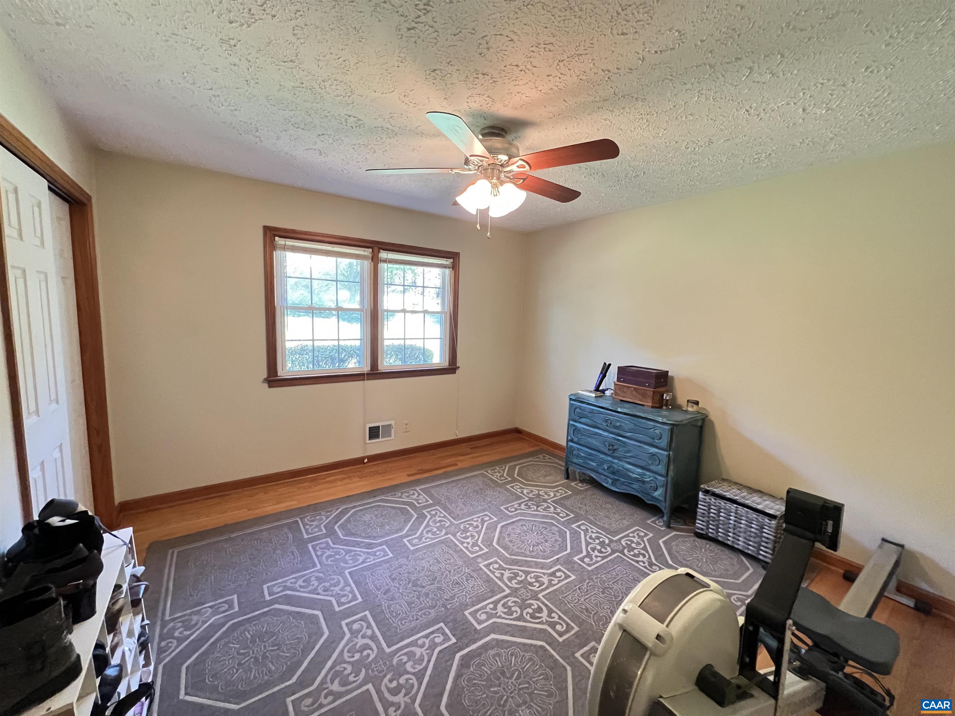 3515 Richmond Road Keswick, VA 22947 - Photo 22 of 47 a bedroom with a bed and a chandelier