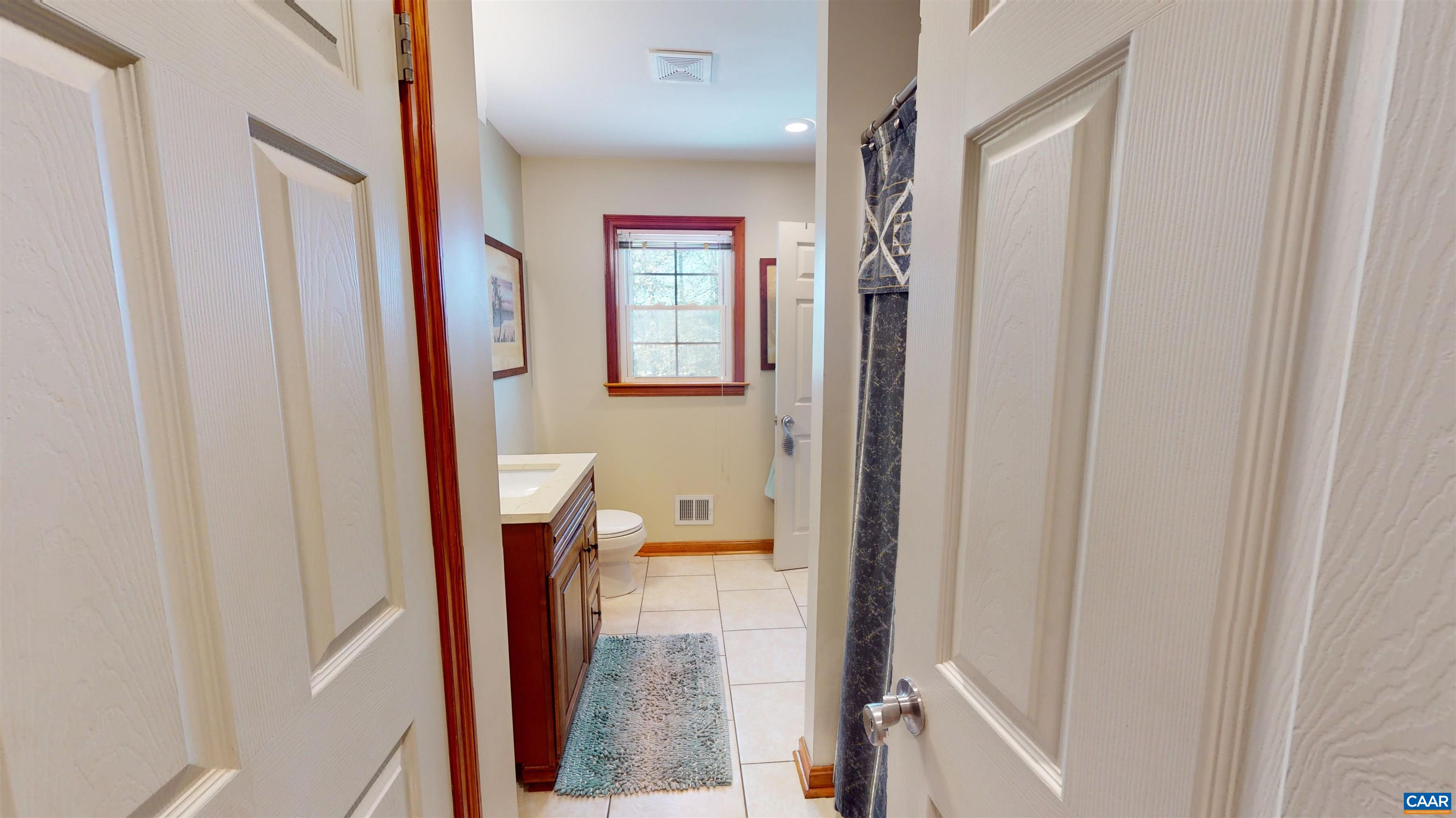 3515 Richmond Road Keswick, VA 22947 - Photo 24 of 47 a bathroom with a bathtub and a shower