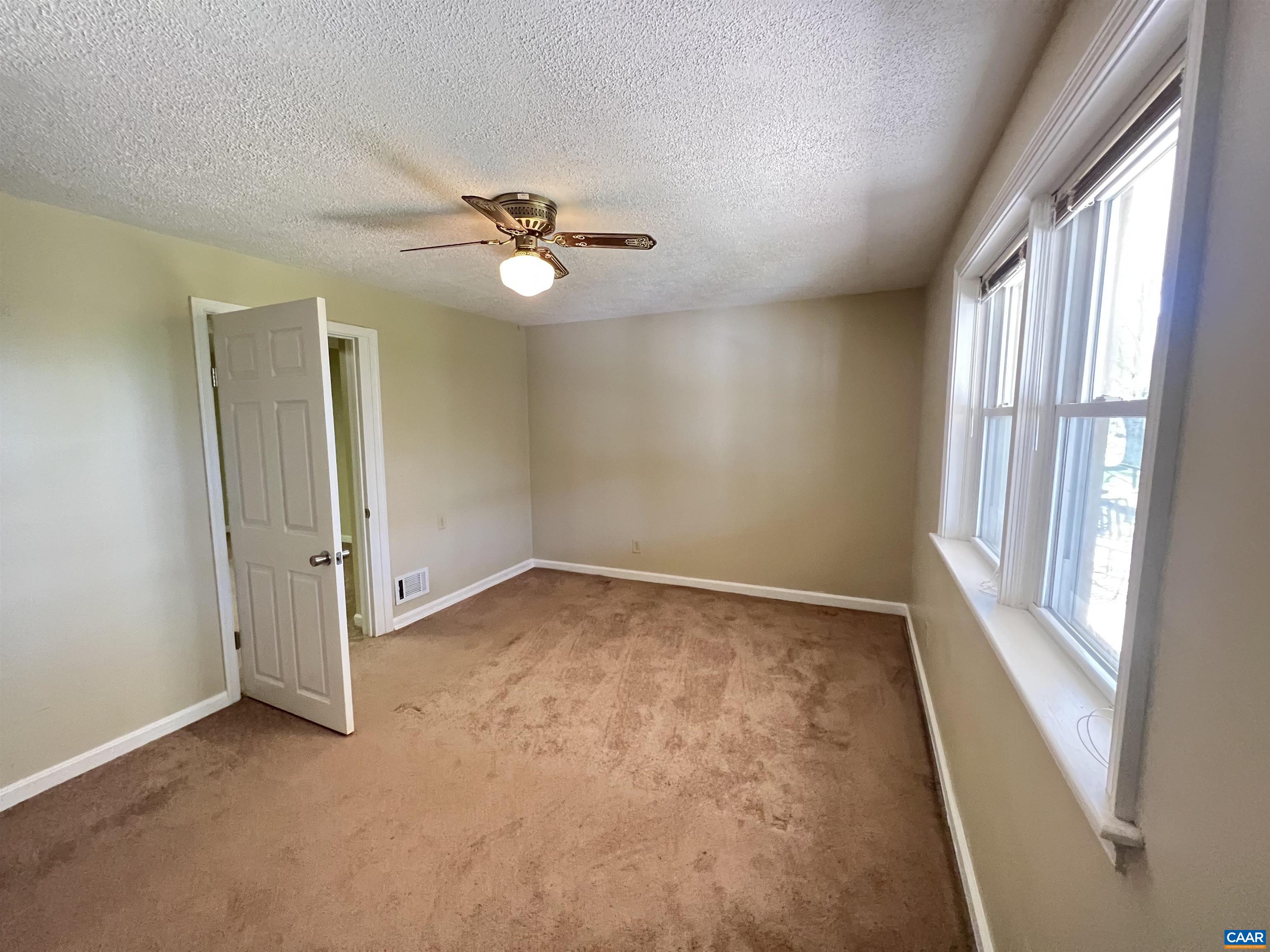 3515 Richmond Road Keswick, VA 22947 - Photo 28 of 47 an empty room with windows and fan