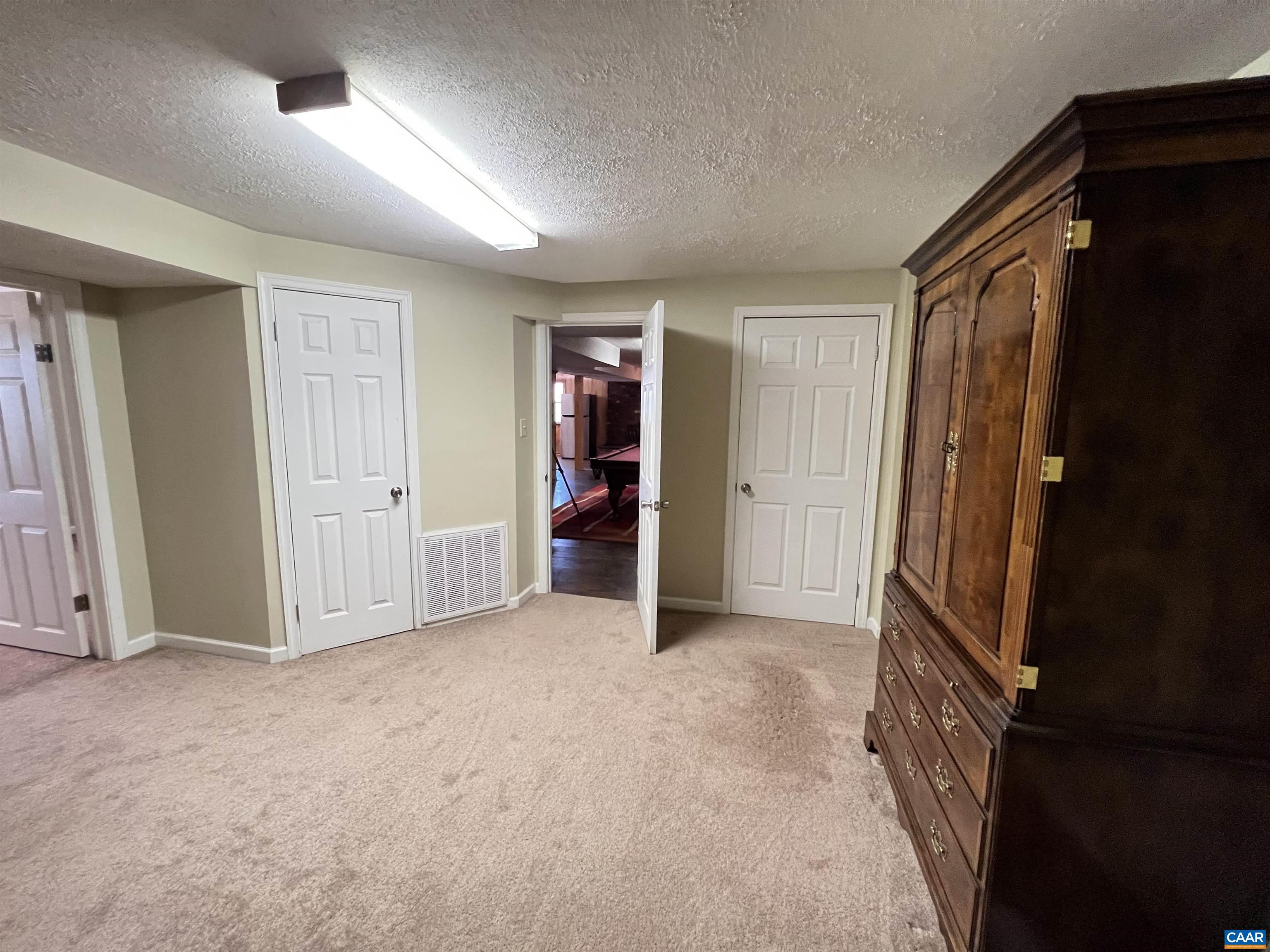 3515 Richmond Road Keswick, VA 22947 - Photo 30 of 47 an empty room with walk in closet and stairs