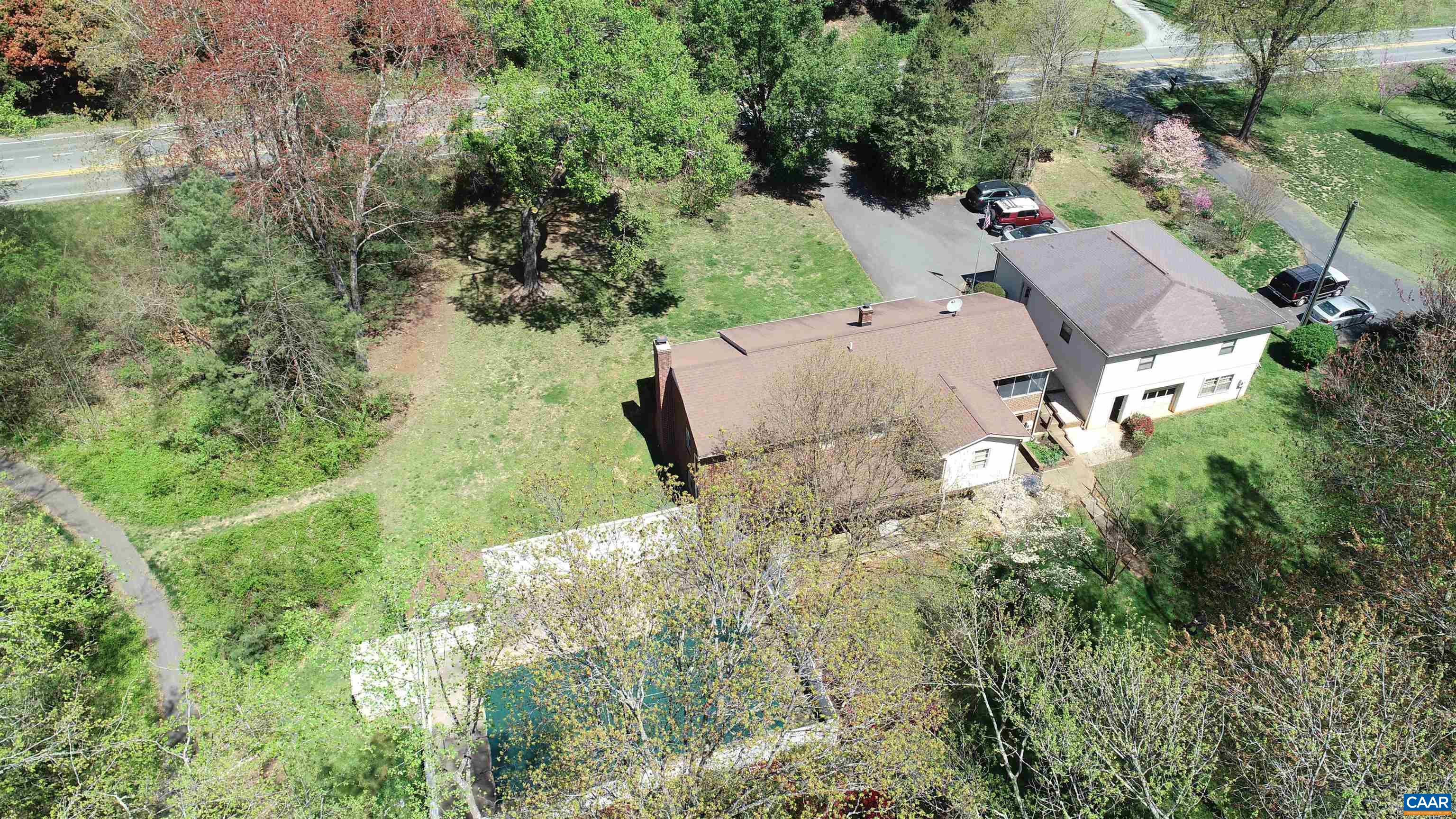 3515 Richmond Road Keswick, VA 22947 - Photo 39 of 47 an aerial view of a house with yard and outdoor seating