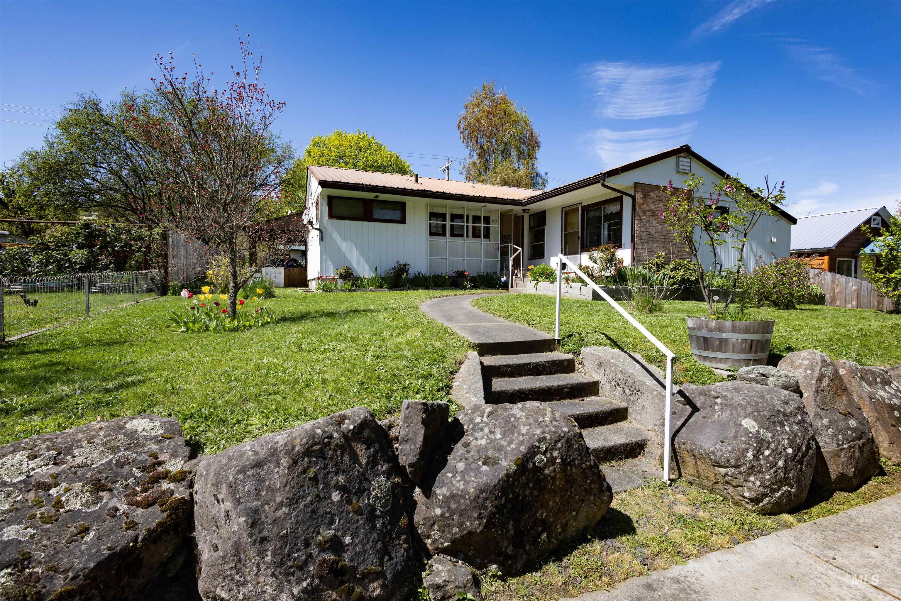 712 Hill Street Kamiah, ID 83536 - Photo 2 of 41 Mid-century modern residence featuring white siding and a contrasting dark roofline