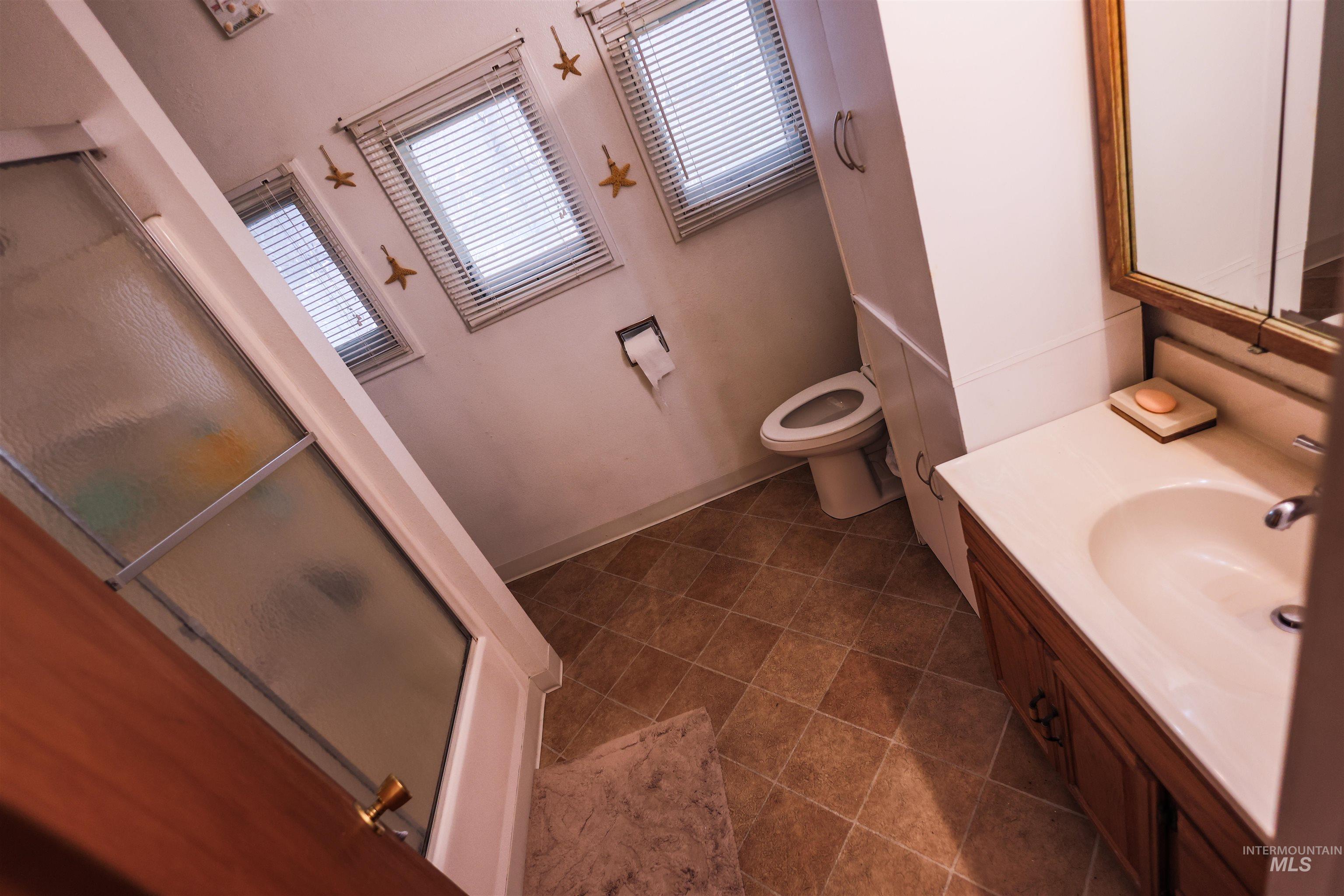 712 Hill Street Kamiah, ID 83536 - Photo 23 of 41 Full bathroom featuring vanity and a stall shower