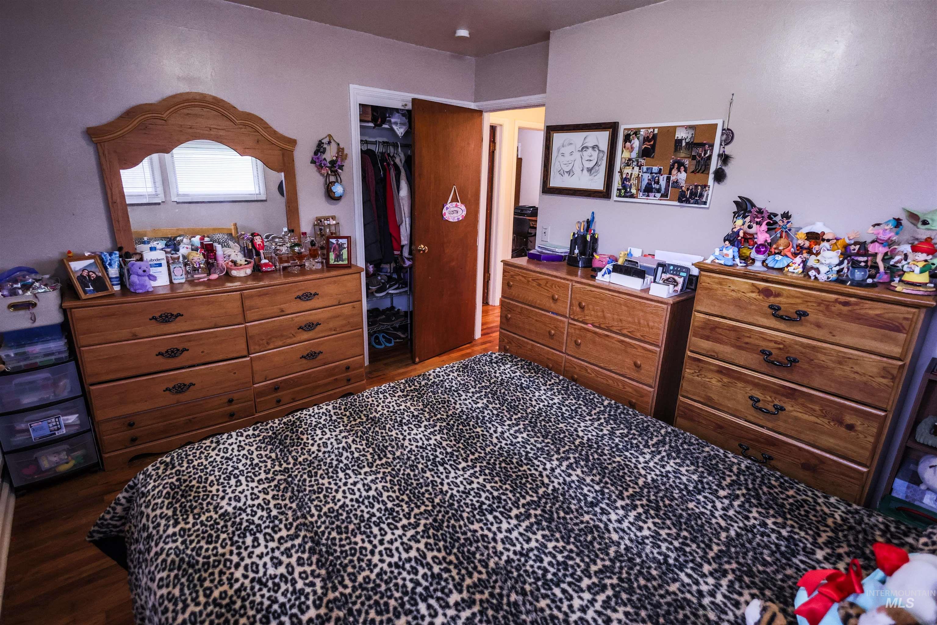 712 Hill Street Kamiah, ID 83536 - Photo 24 of 41 Bedroom with a walk in closet and dark wood finished floors