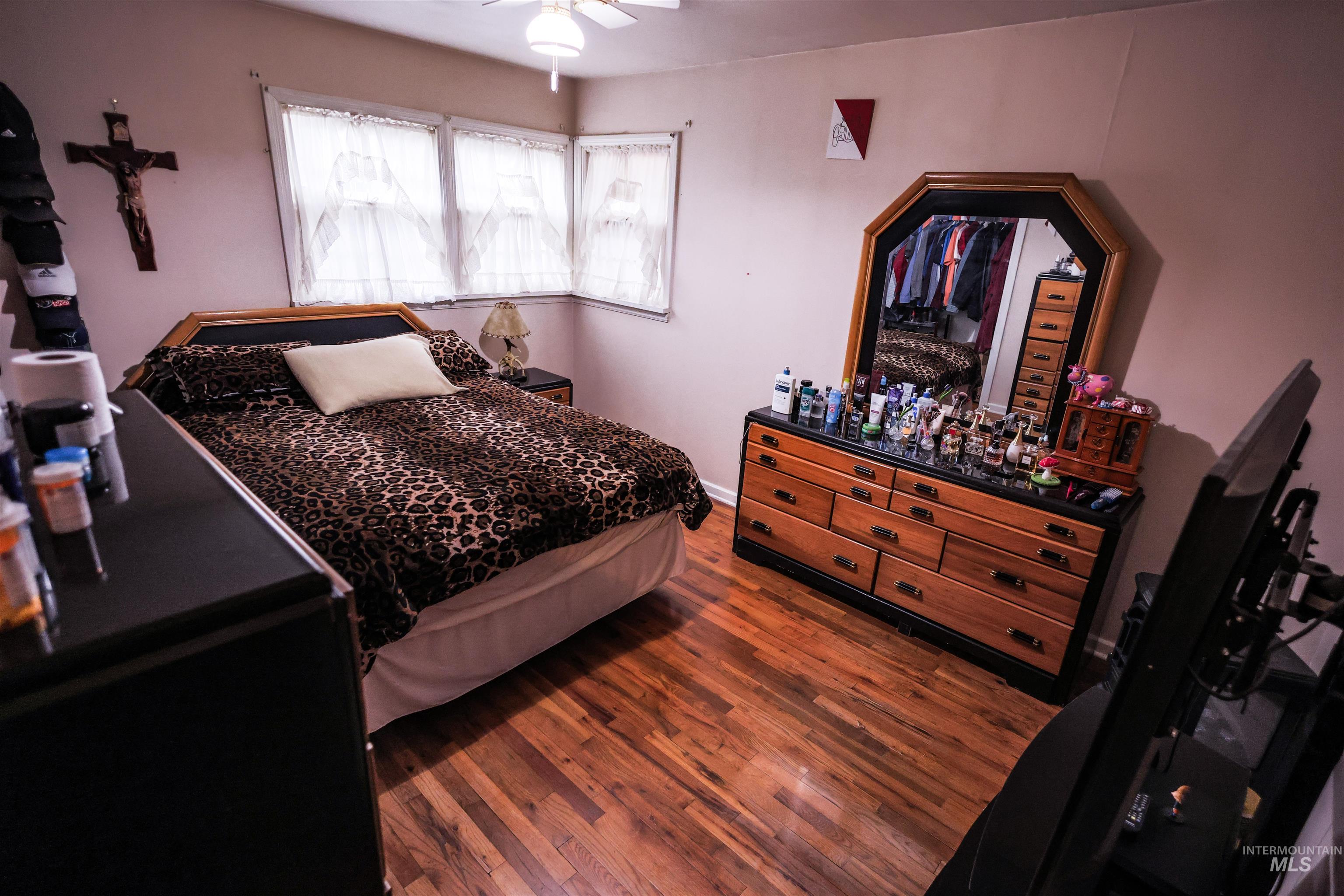 712 Hill Street Kamiah, ID 83536 - Photo 26 of 41 Bedroom with dark wood-style flooring and ceiling fan