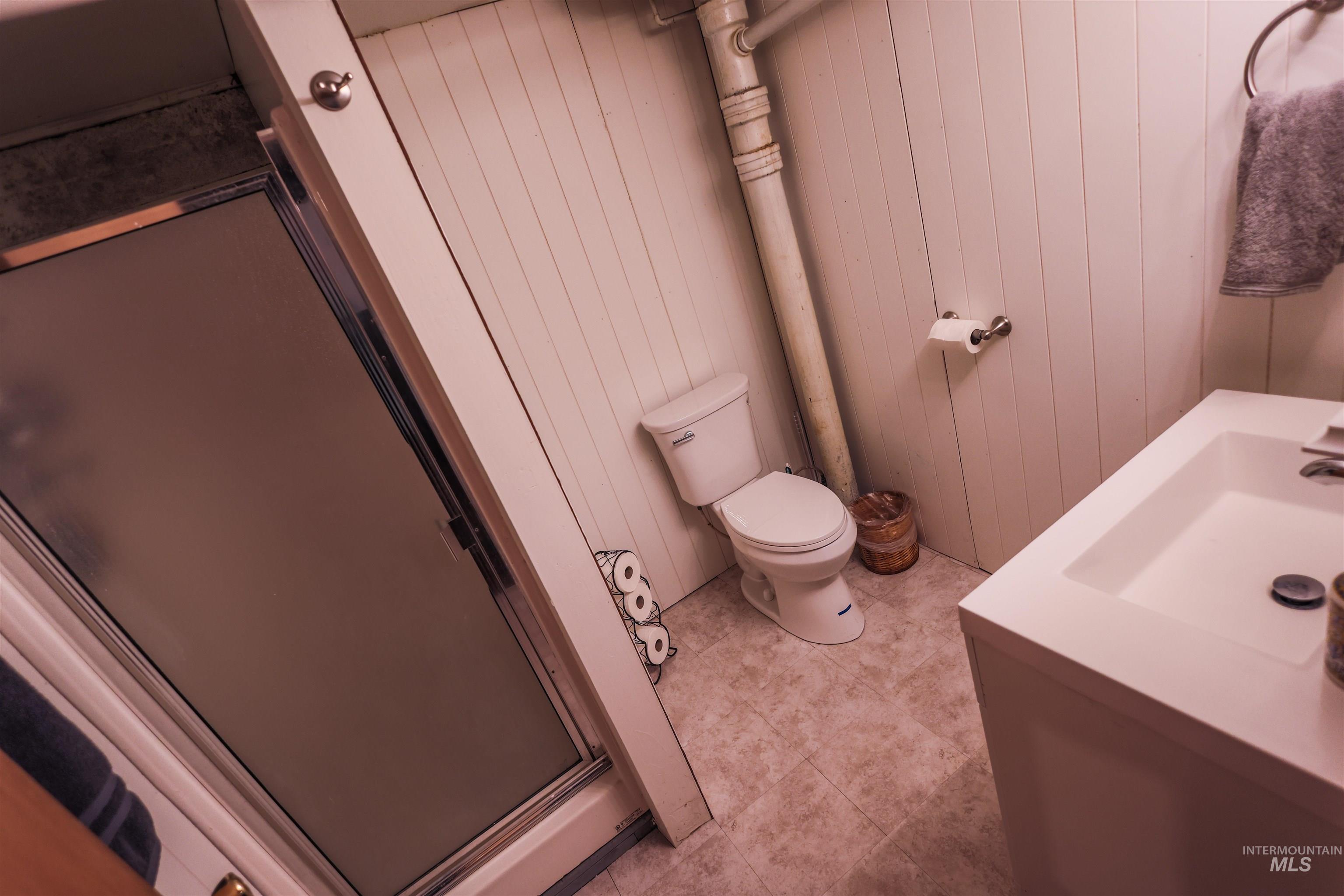 712 Hill Street Kamiah, ID 83536 - Photo 34 of 41 Bathroom with a shower stall and vanity
