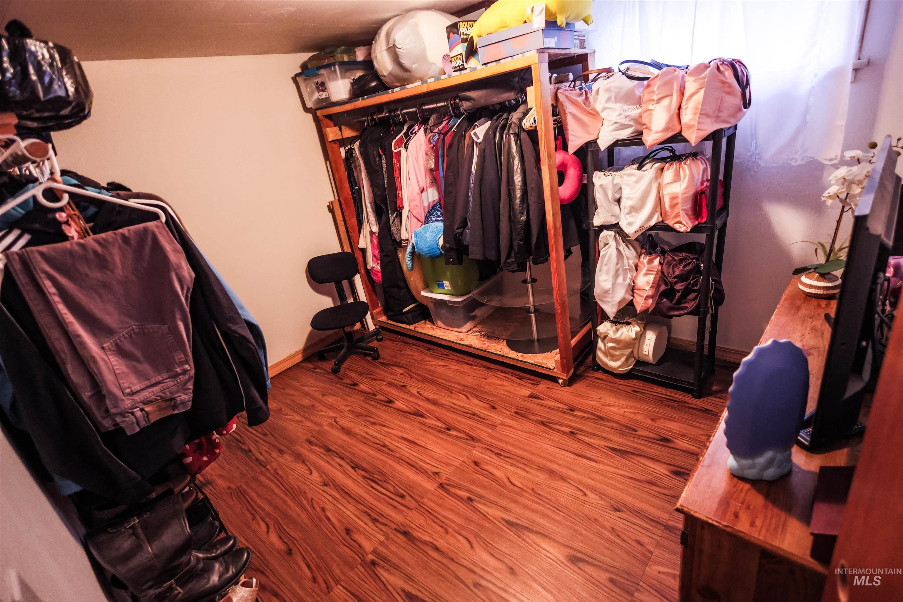 712 Hill Street Kamiah, ID 83536 - Photo 35 of 41 Walk in closet featuring wood finished floors