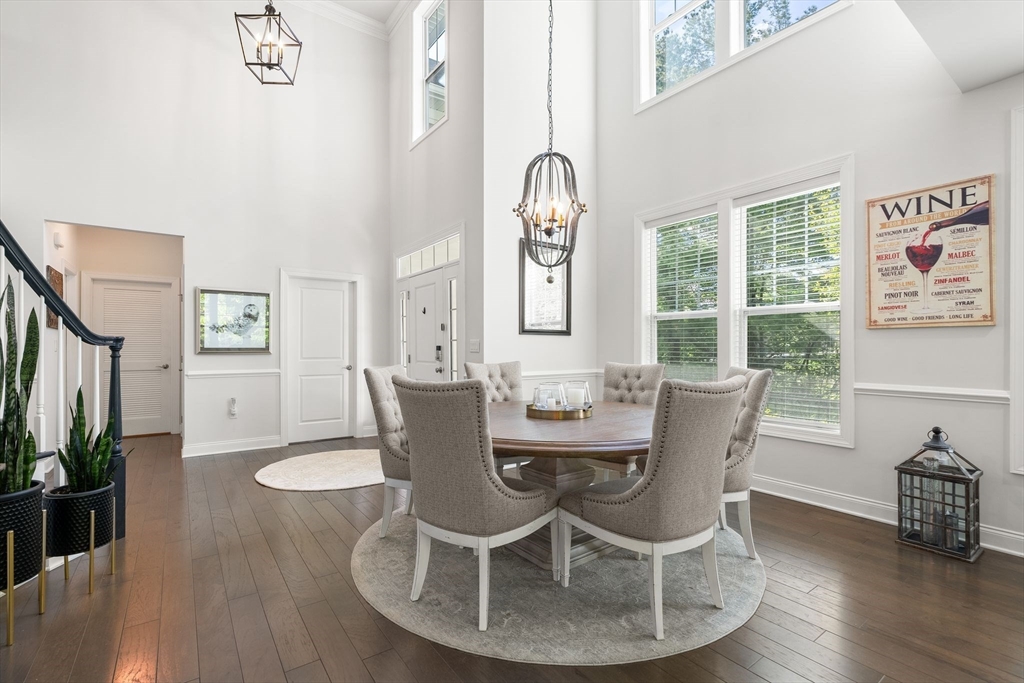 2 Hummingbird Way, Unit 1 Methuen, MA 01844 - Photo 6 of 42 a dining room with furniture a window and wooden floor