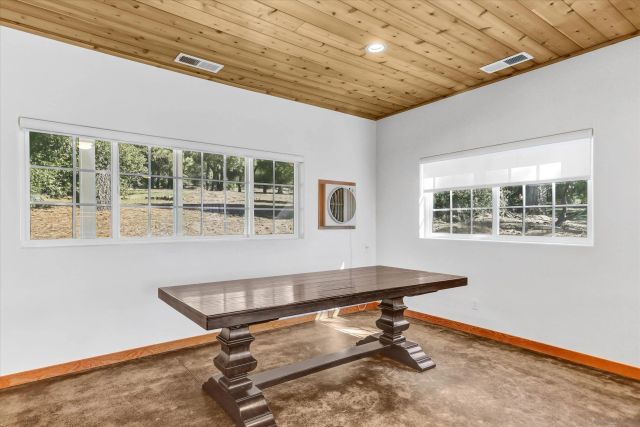 a kitchen with granite countertop stainless steel appliances a sink and cabinets