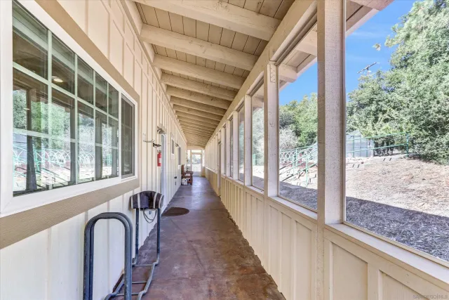 a view of a bathroom with a toilet and a shower