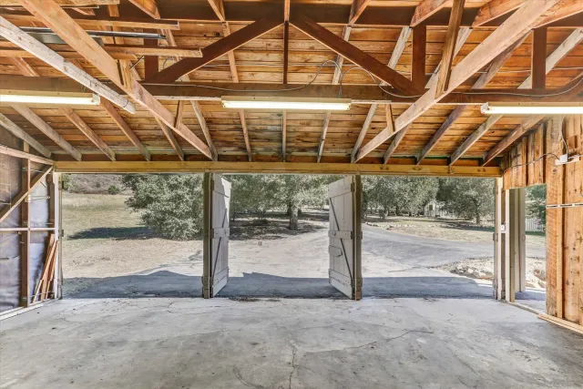 a aerial view of a house with a yard and tree s