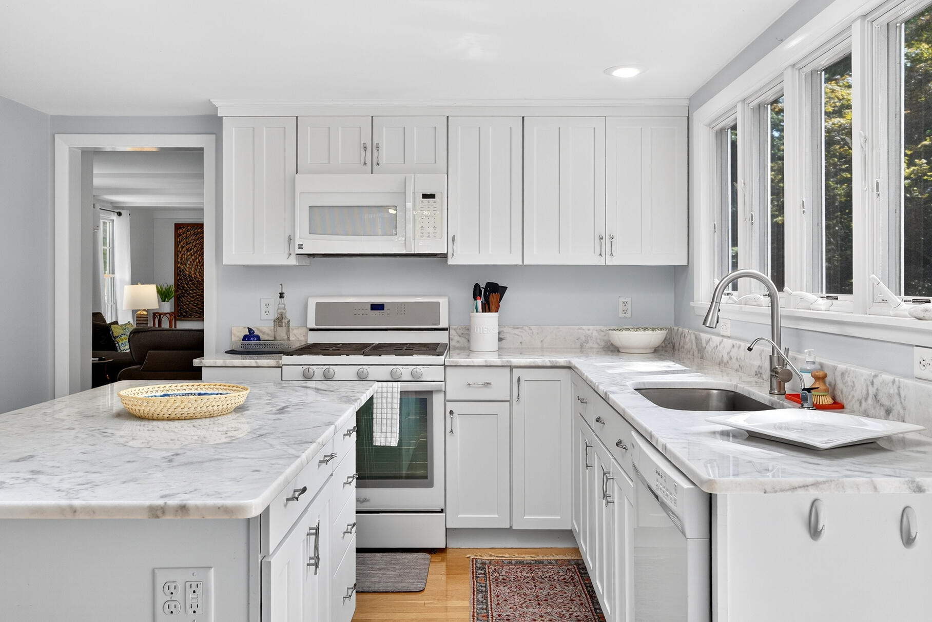 53 Great Oak Road Orleans, MA 02653 - Photo 11 of 53 a kitchen with a sink stove and cabinets