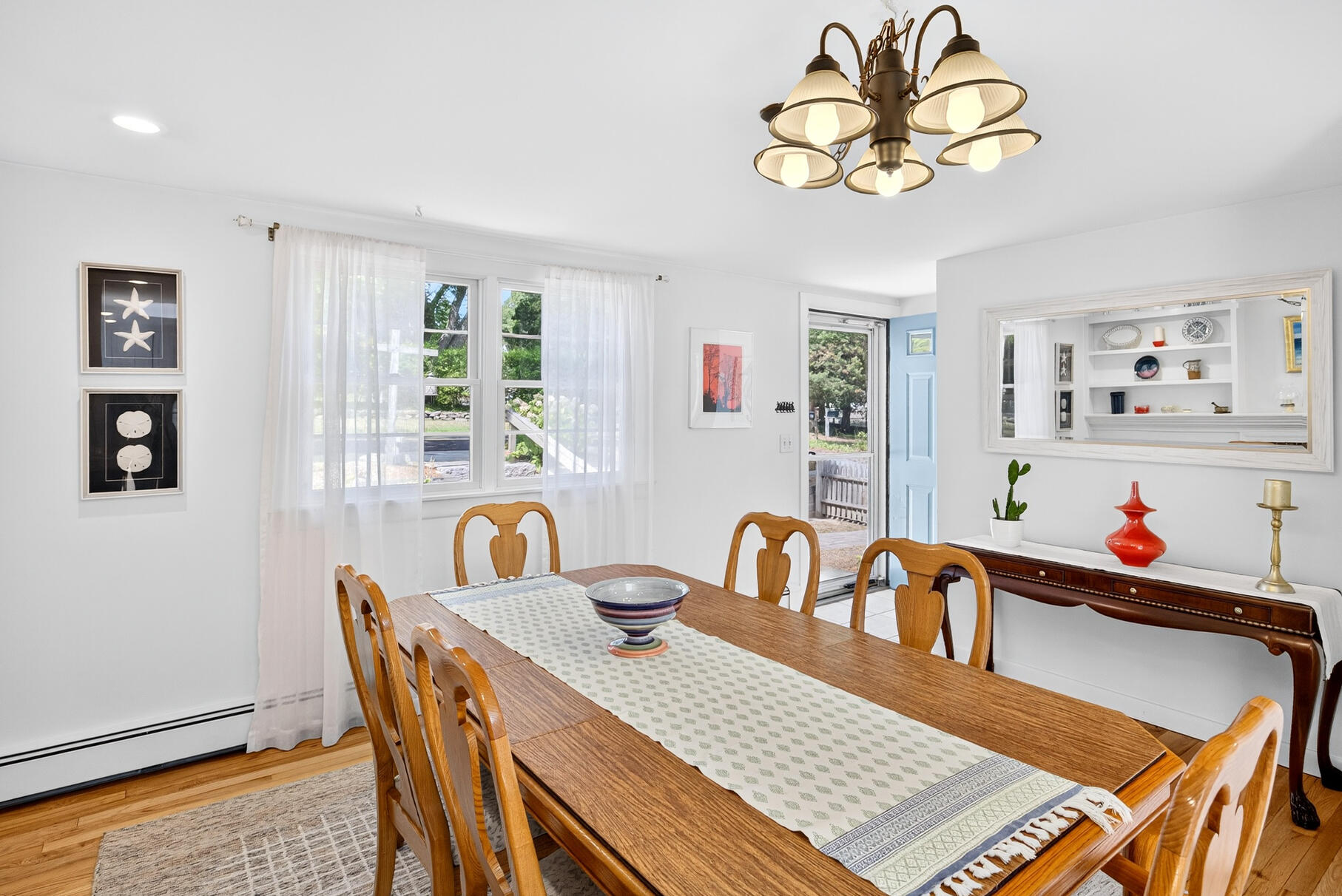 53 Great Oak Road Orleans, MA 02653 - Photo 14 of 53 a view of a dining room with furniture and chandelier
