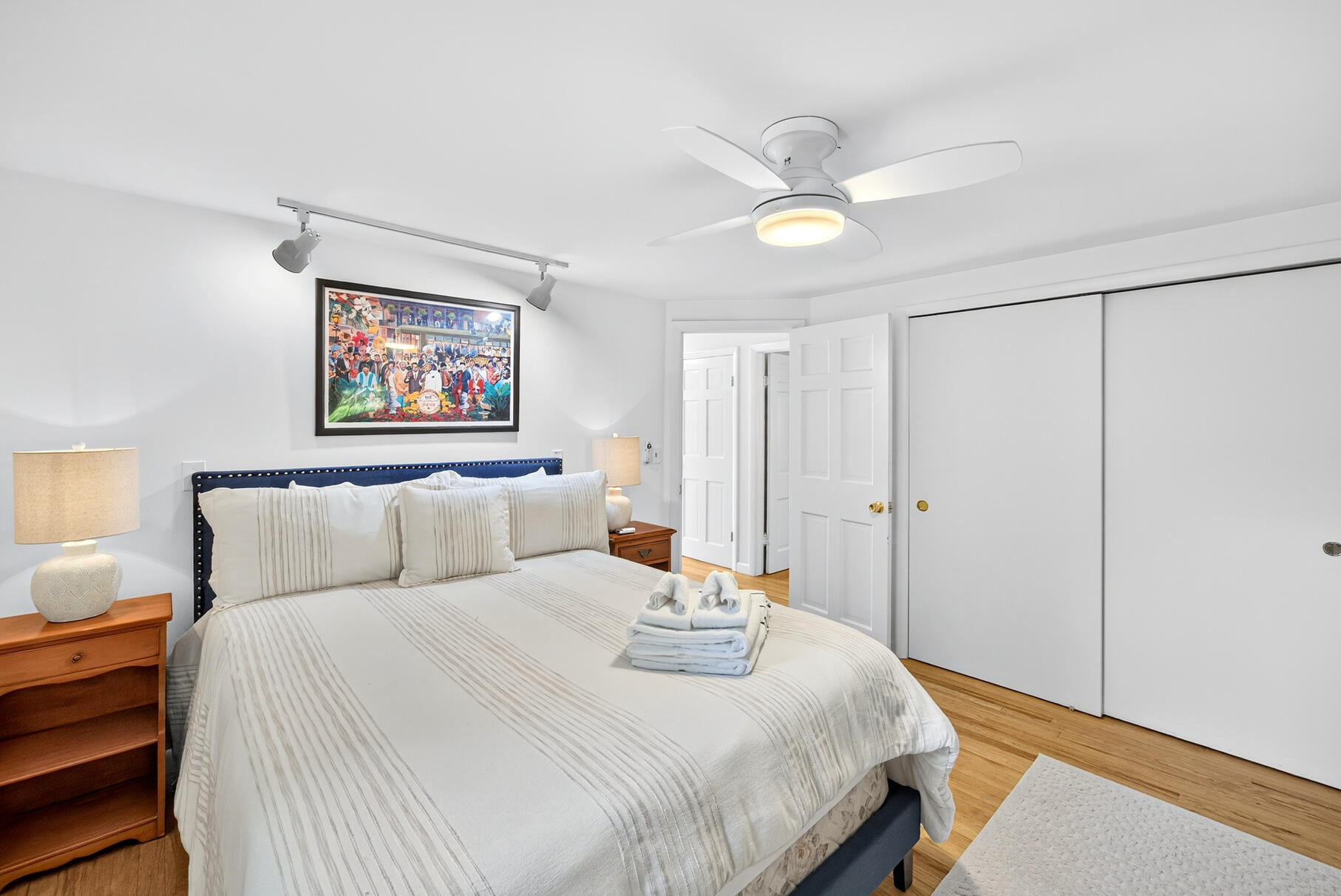 53 Great Oak Road Orleans, MA 02653 - Photo 18 of 53 a bedroom with a bed and a painting on the wall