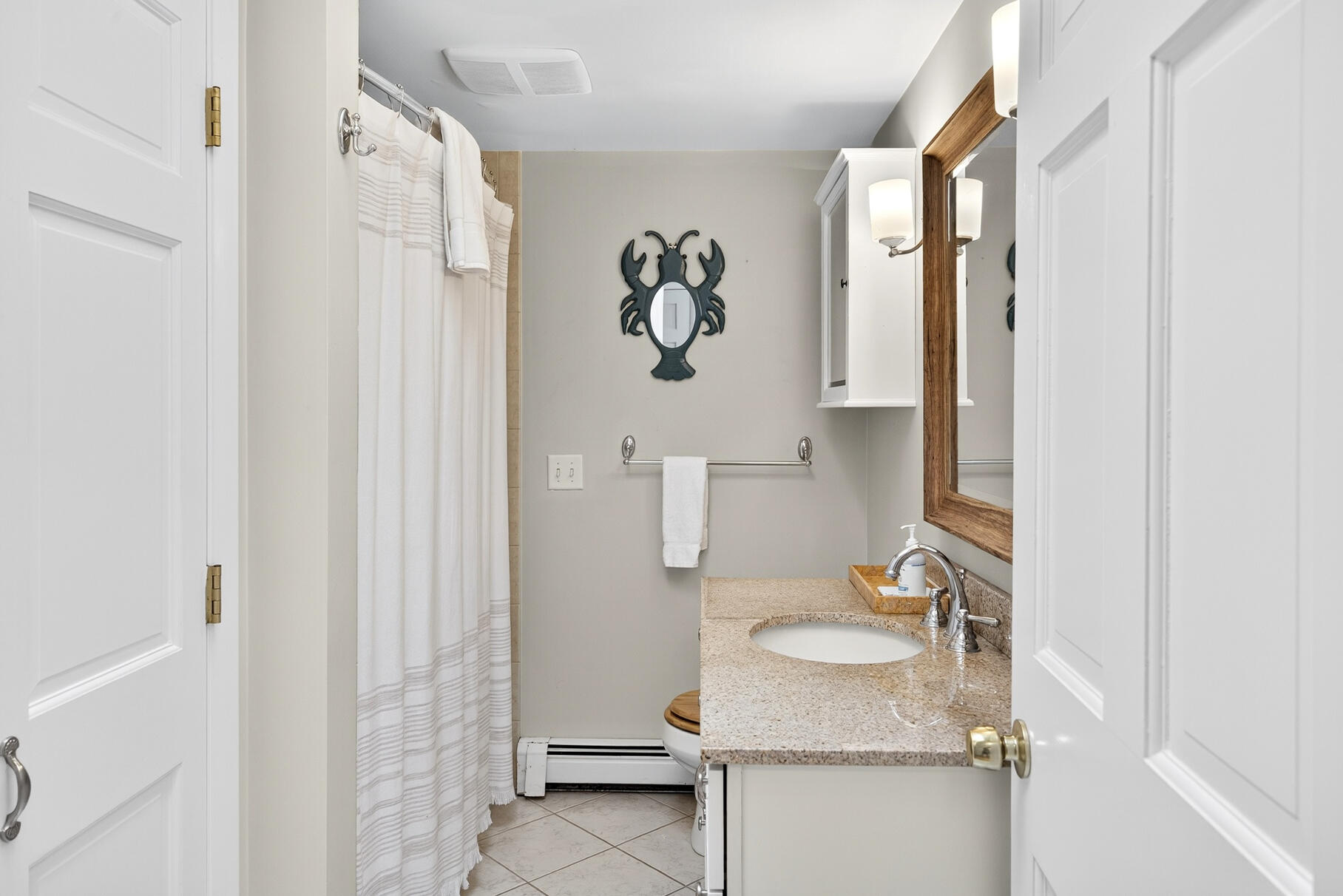 53 Great Oak Road Orleans, MA 02653 - Photo 24 of 53 a bathroom with a granite countertop sink toilet and shower