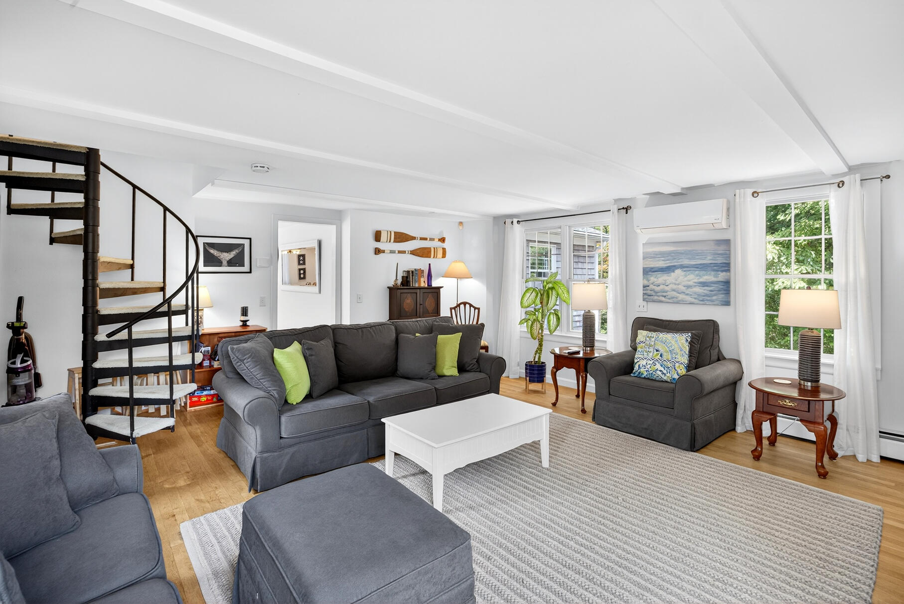 53 Great Oak Road Orleans, MA 02653 - Photo 27 of 53 a living room with furniture a fireplace and a window