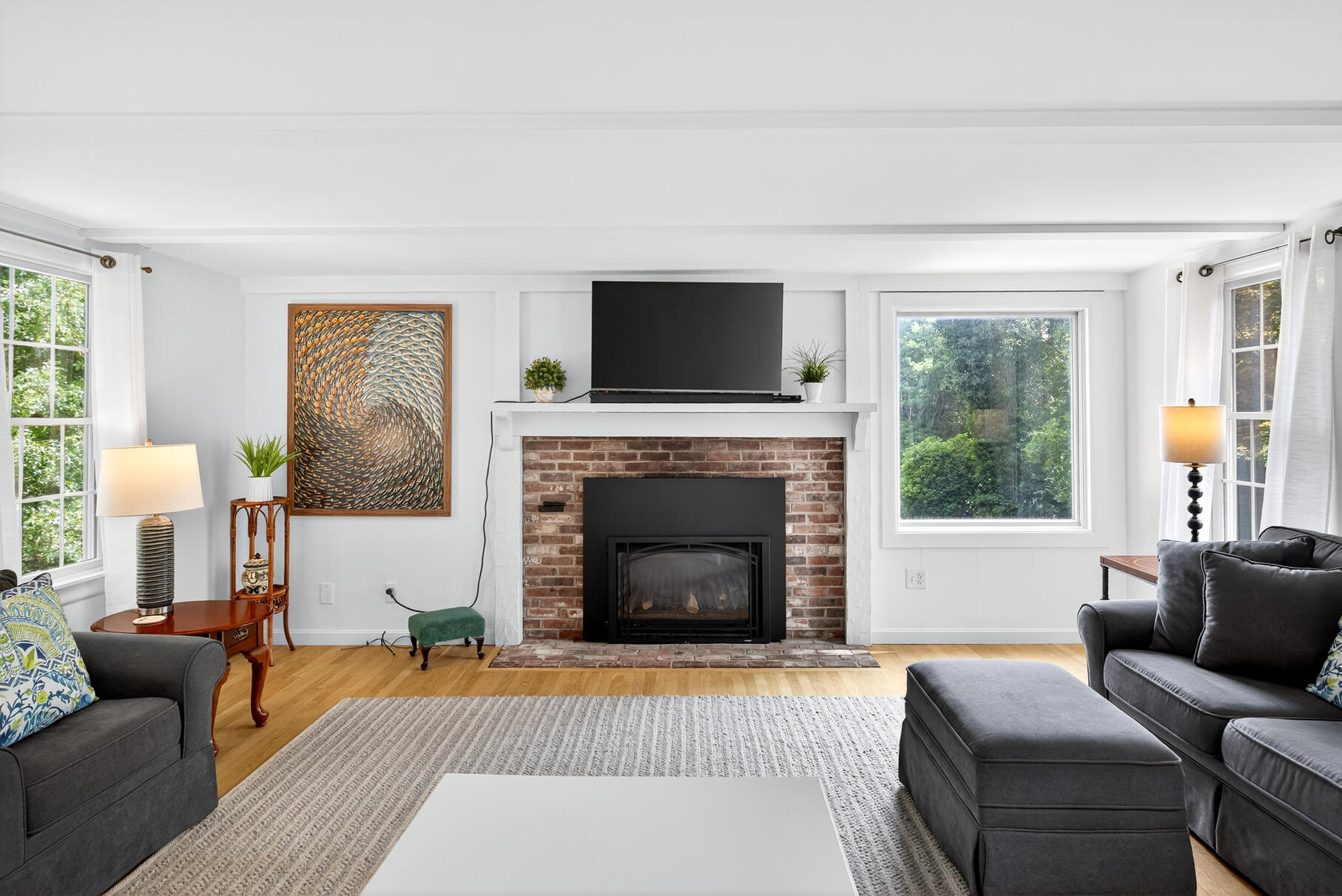 53 Great Oak Road Orleans, MA 02653 - Photo 28 of 53 a living room with furniture a flat screen tv and a fireplace
