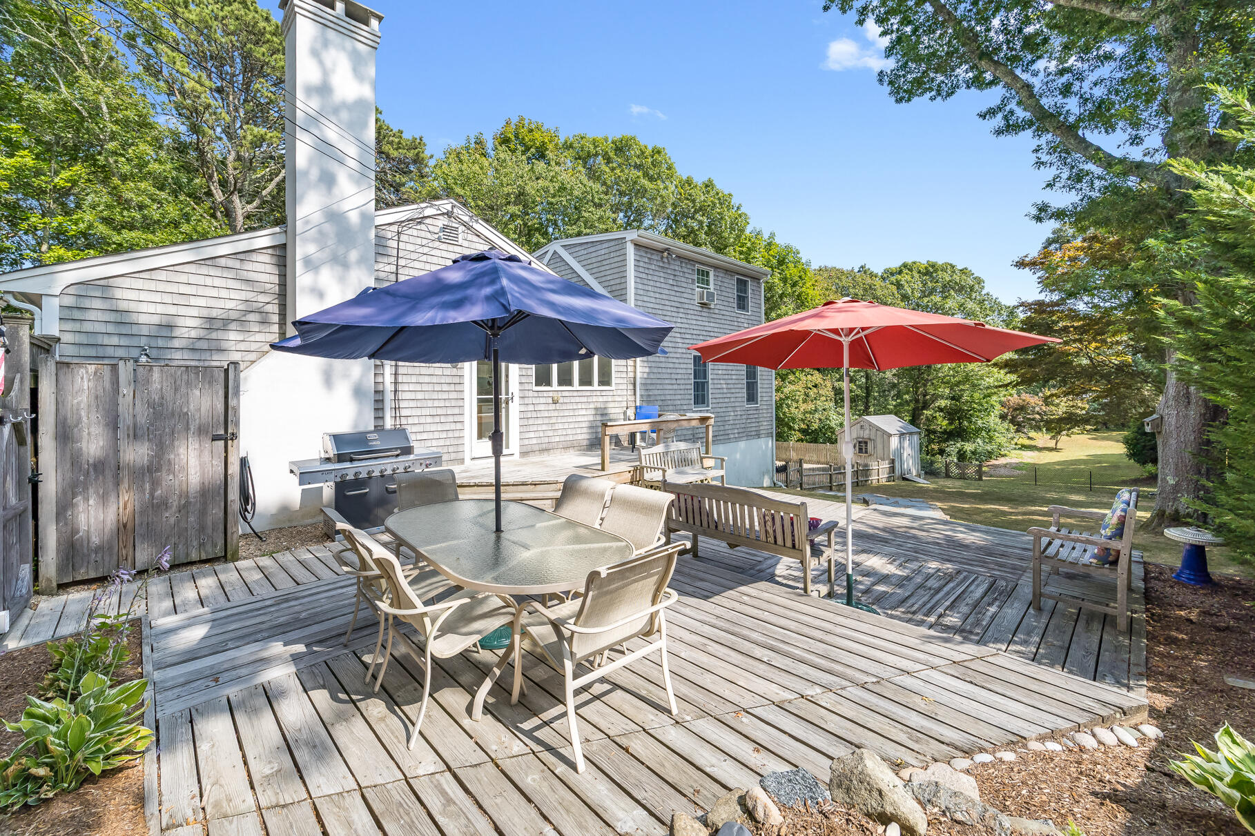53 Great Oak Road Orleans, MA 02653 - Photo 41 of 53 a view of a patio with furniture and a table