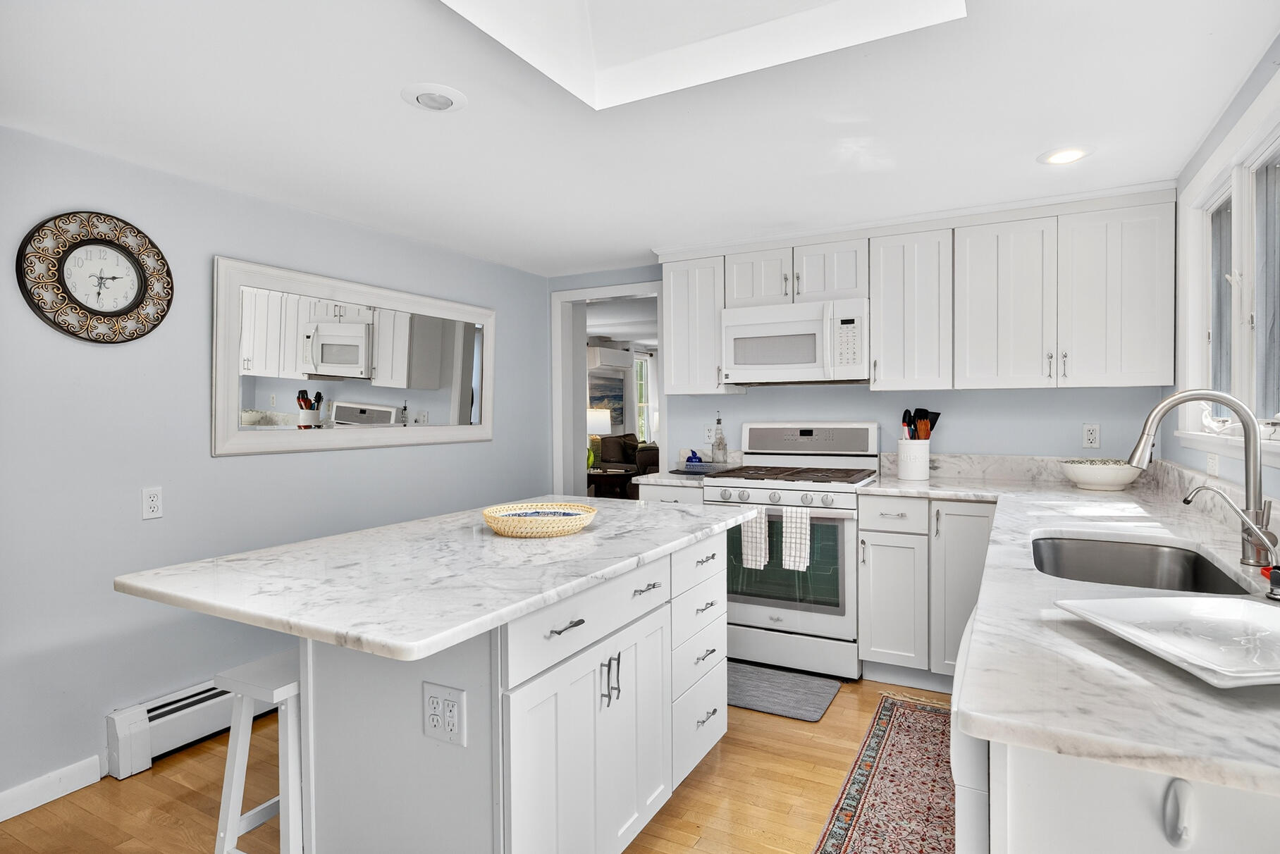 53 Great Oak Road Orleans, MA 02653 - Photo 10 of 53 a kitchen with granite countertop white cabinets and white appliances
