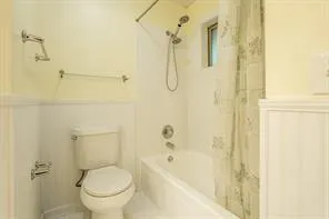 a bathroom with a shower and a toilet