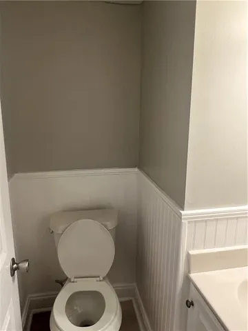 a bathroom with a toilet and a sink