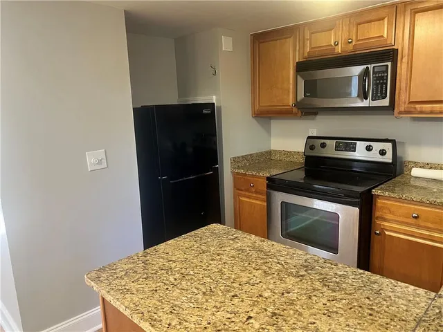a kitchen with a stove and a microwave