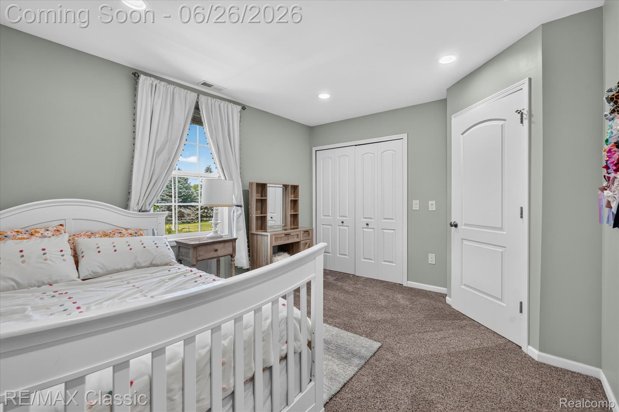 3205 North Milford Road Highland, MI 48357 - Photo 24 of 53 Bedroom featuring recessed lighting and a large window with white trim