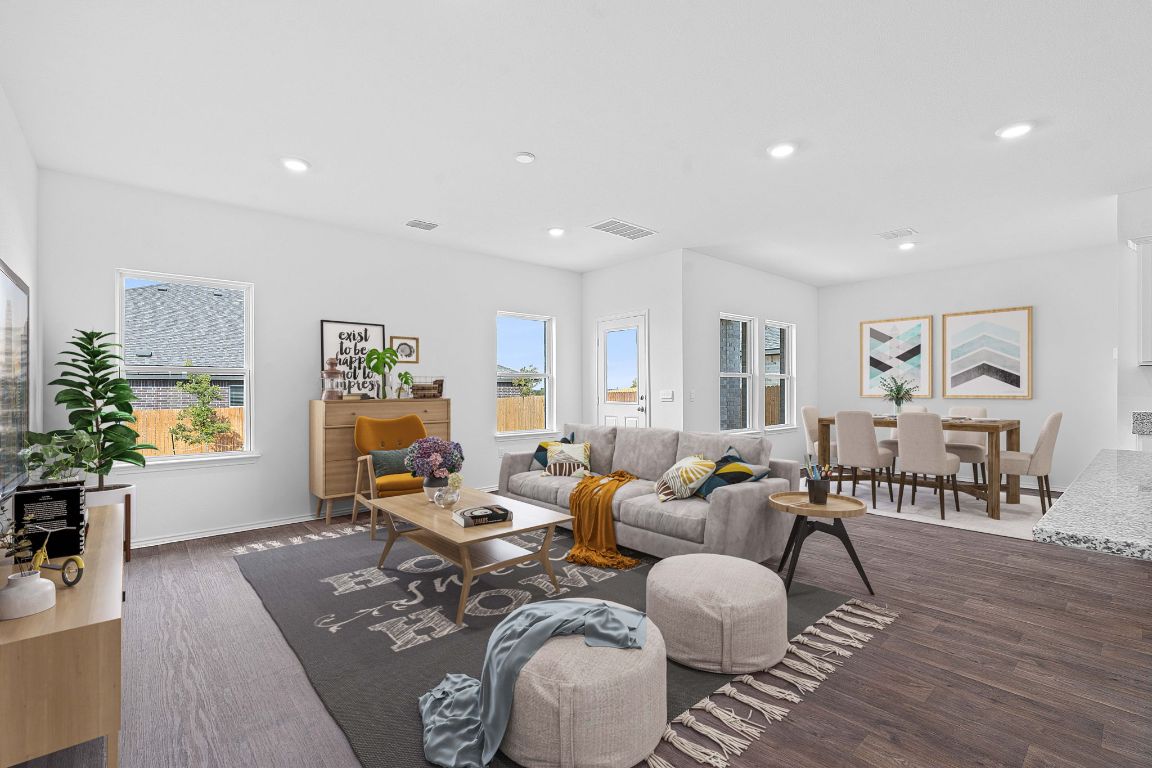 18500 B Empire Path Manor, TX 78653 - Photo 4 of 31 Living area featuring recessed lighting and dark wood-style flooring