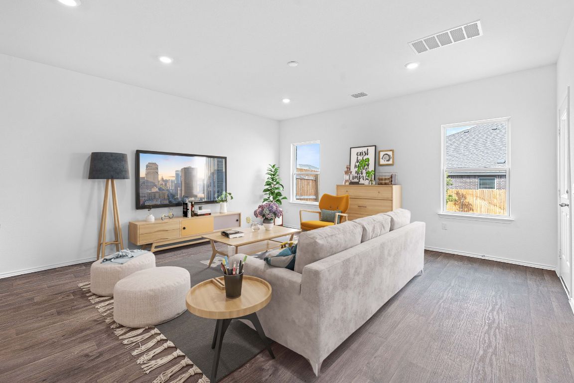 18500 B Empire Path Manor, TX 78653 - Photo 5 of 31 Living room with wood finished floors and recessed lighting