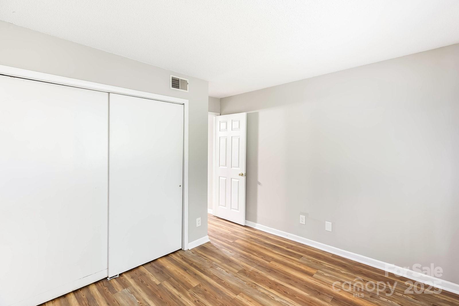11015 Harrowfield Road Charlotte, NC 28226 - Photo 15 of 28 a view of a room with wooden floor