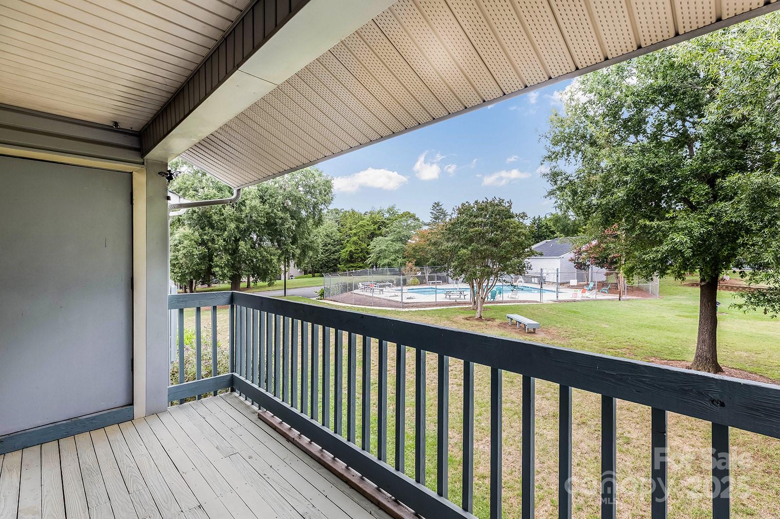 11015 Harrowfield Road Charlotte, NC 28226 - Photo 19 of 28 a view of balcony with wooden floor and fence