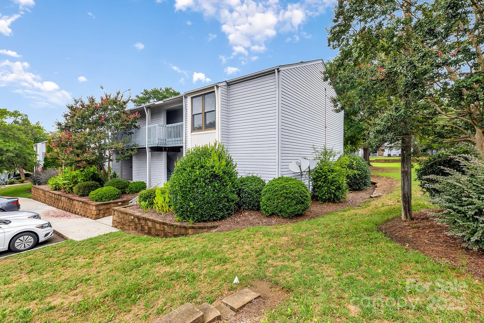 11015 Harrowfield Road Charlotte, NC 28226 - Photo 23 of 28 a view of a house with backyard and garden