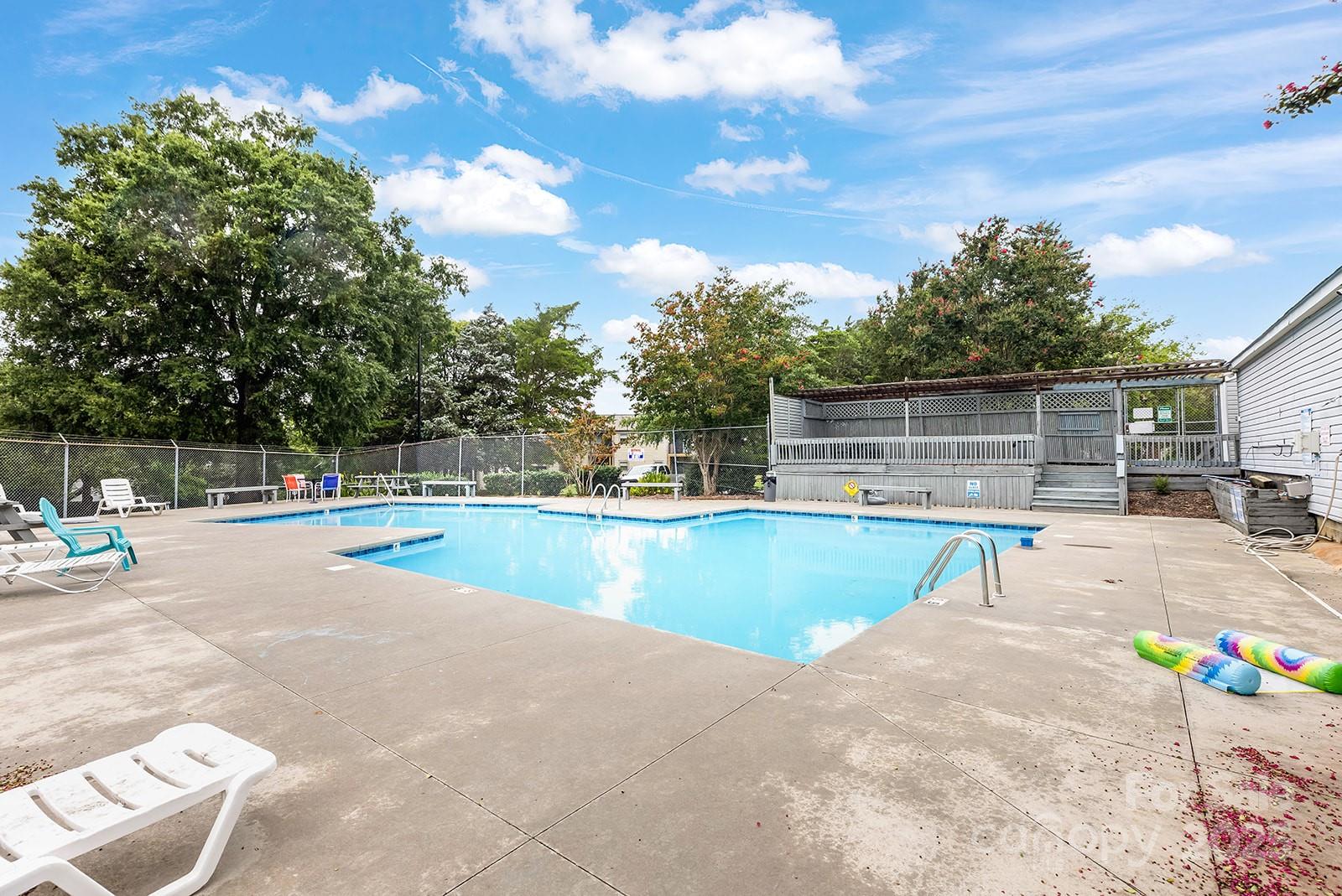 11015 Harrowfield Road Charlotte, NC 28226 - Photo 26 of 28 a view of a swimming pool with a patio