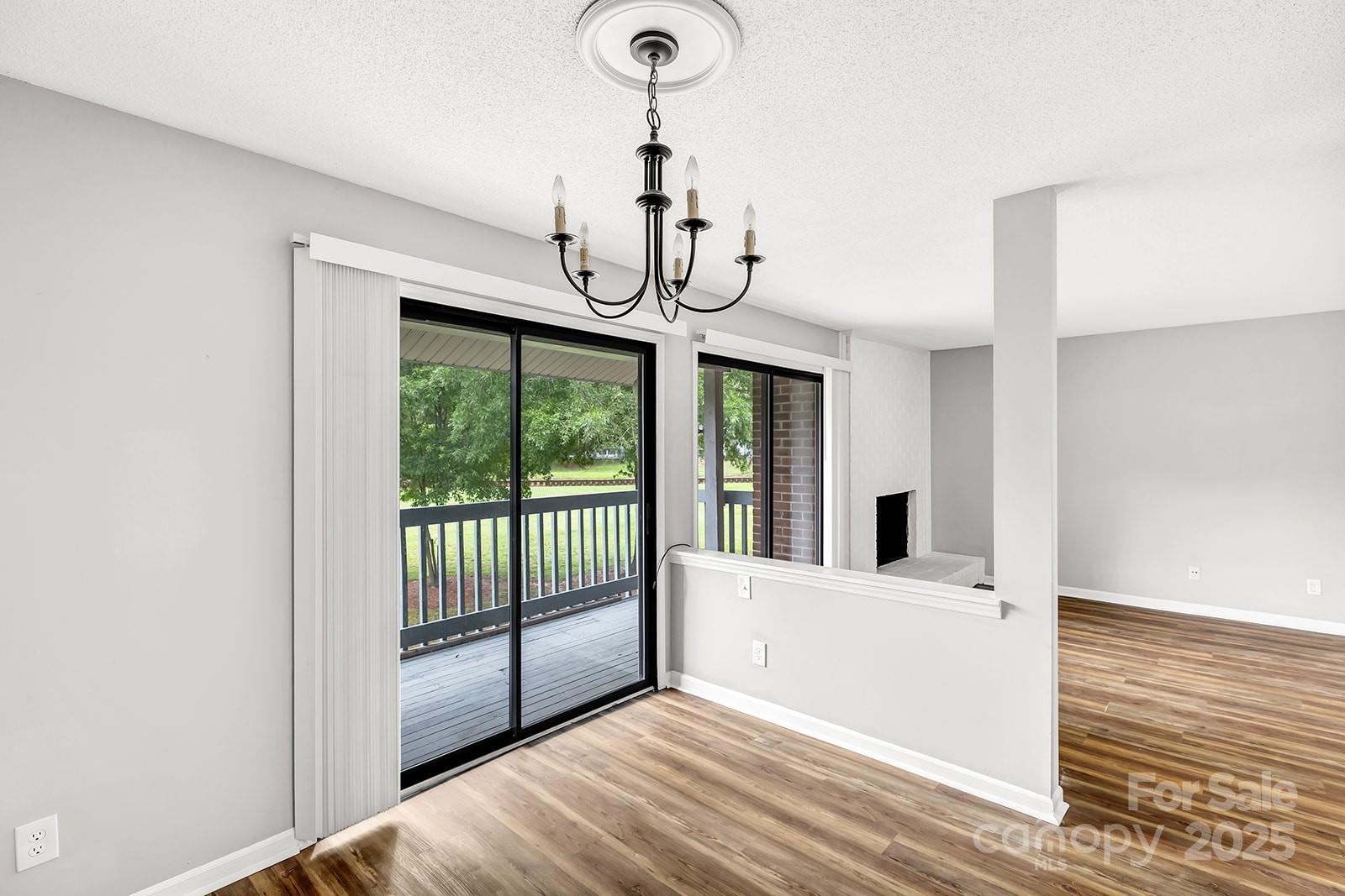 11015 Harrowfield Road Charlotte, NC 28226 - Photo 5 of 28 a view of a room with wooden floor and windows