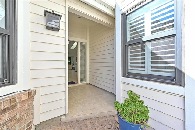 a view of a house with a door and a window