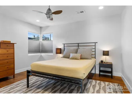 a bedroom with a bed and a table