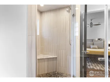 a bathroom with a shower and a sink