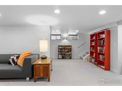 a living room with furniture and gym equipment