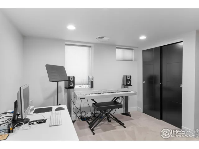 a workspace with furniture and a air conditioner