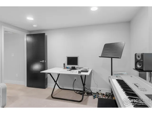 a work room with furniture and a lamp