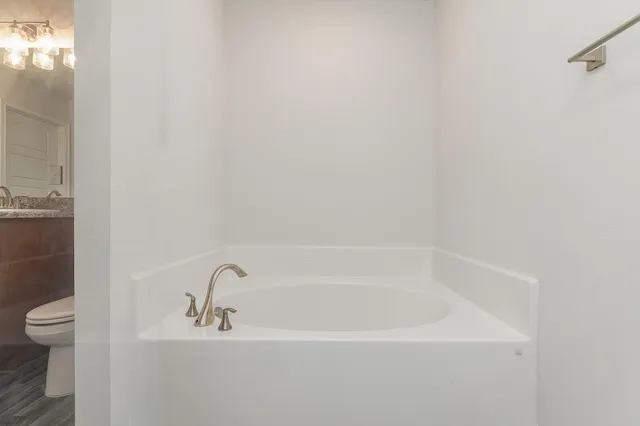 a bathroom with a glass shower door