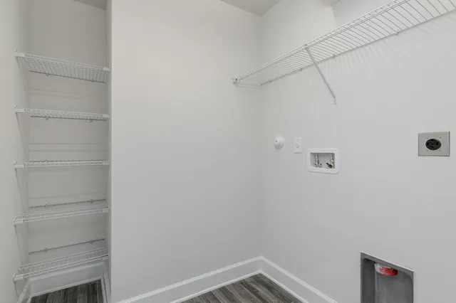 a kitchen with granite countertop a sink and white cabinets