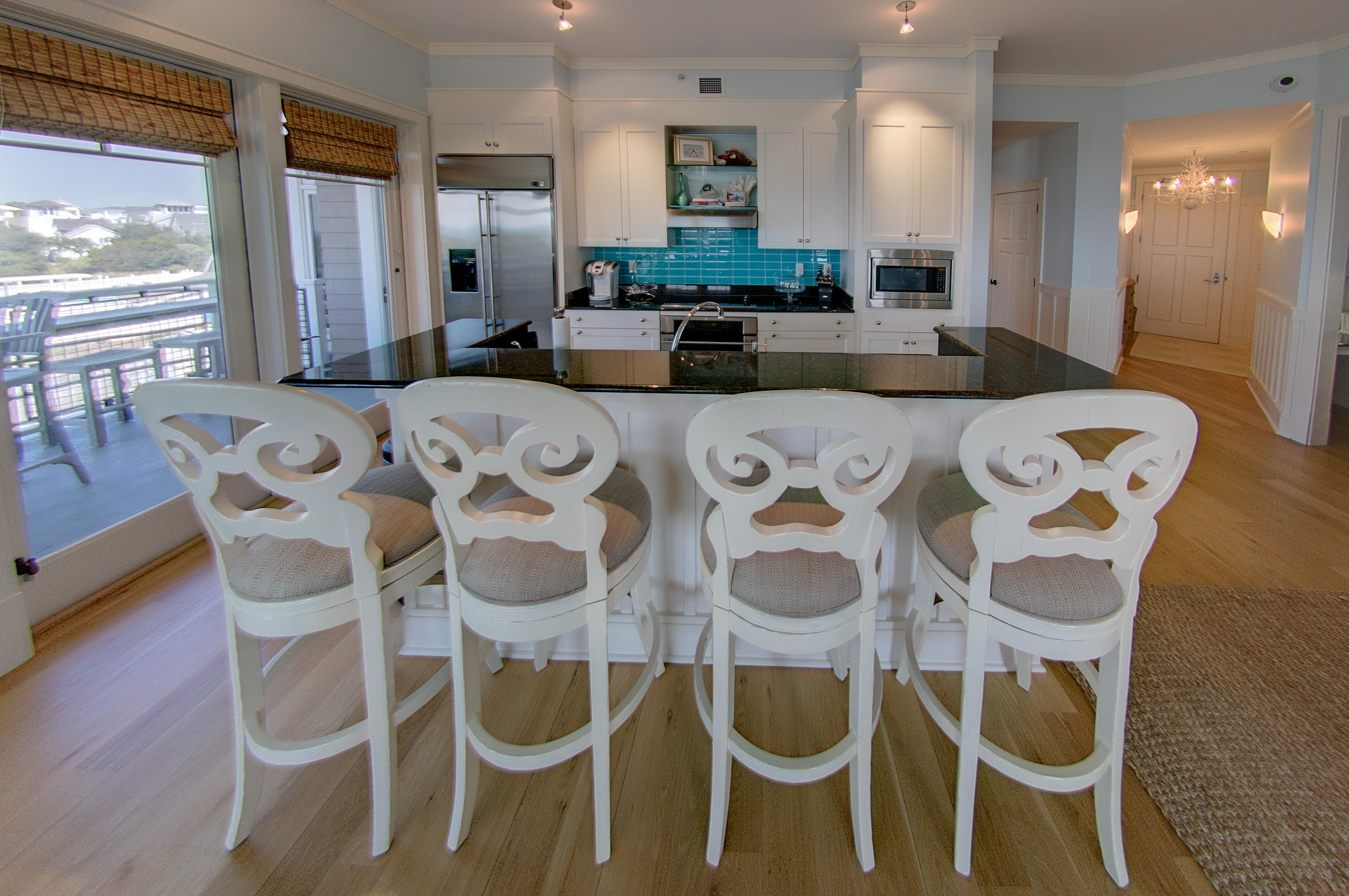 99 Compass Point Way Inlet Beach, Unit 308 Inlet Beach, FL 32461 - Photo 17 of 55 a view of a dining room with furniture and wooden floor