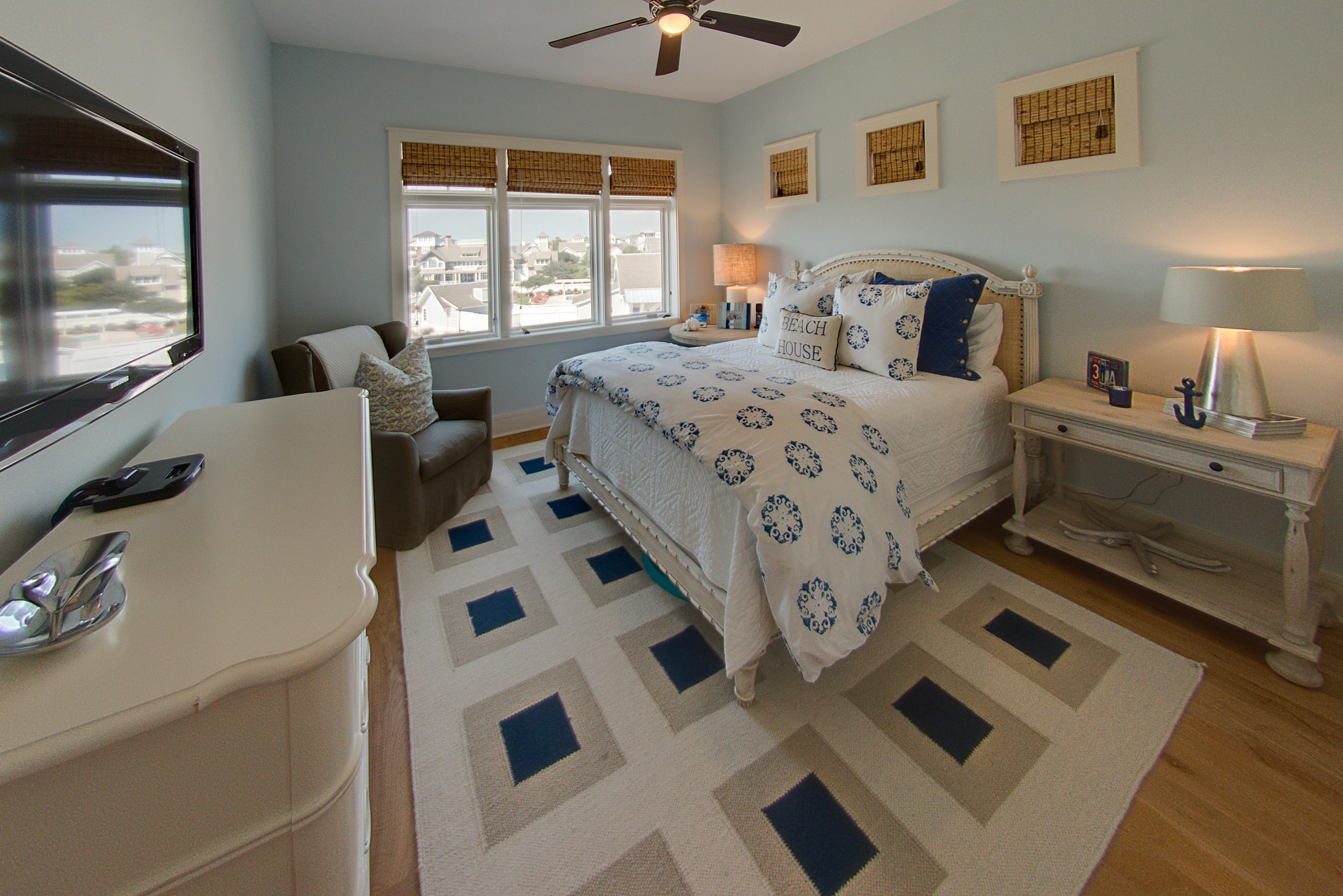 99 Compass Point Way Inlet Beach, Unit 308 Inlet Beach, FL 32461 - Photo 39 of 55 a bedroom with a bed and a flat tv screen on the dresser
