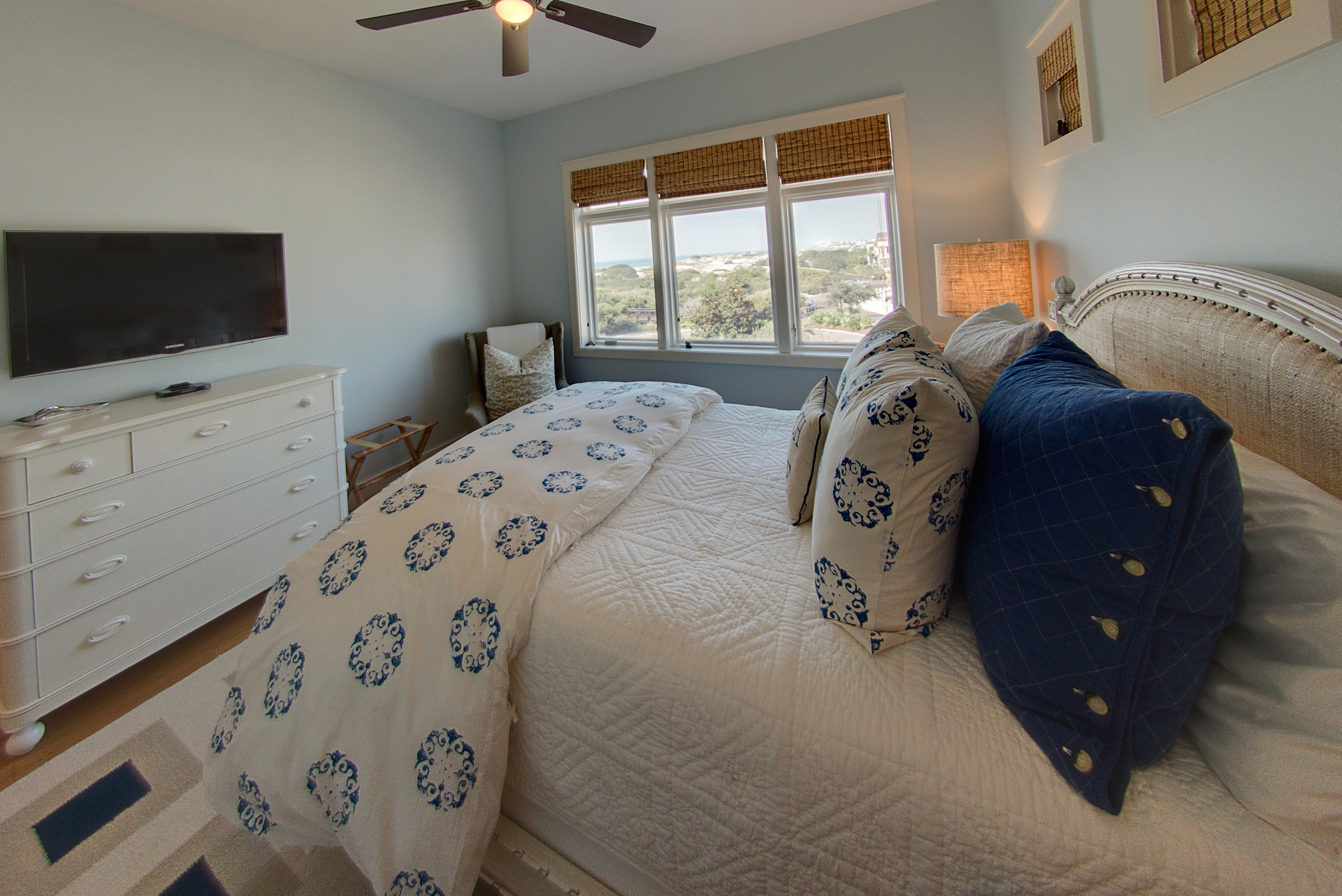 99 Compass Point Way Inlet Beach, Unit 308 Inlet Beach, FL 32461 - Photo 40 of 55 a bedroom with a bed and flat tv screen on the dresser