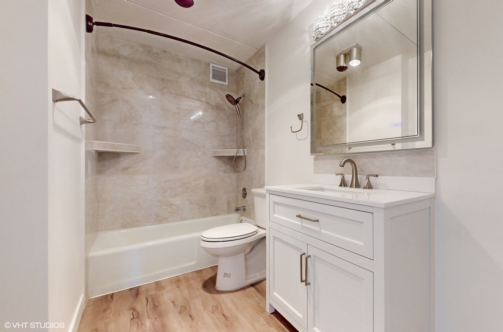2005 South Finley Road, Unit 805 Lombard, IL 60148 - Photo 19 of 34 a bathroom with a sink toilet a mirror and shower
